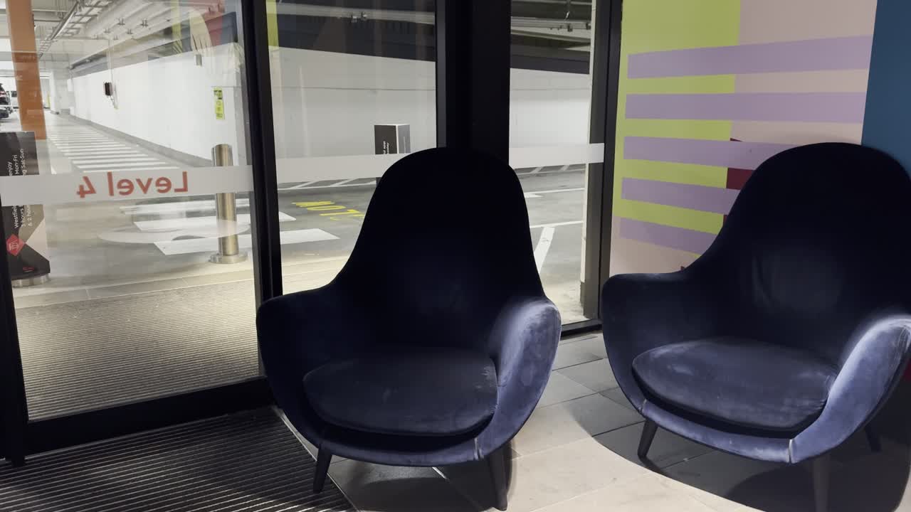 rest area, 2 sofa in a mall, by the parking lot