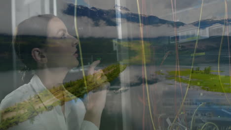using animation, woman interacting with digital interface over scenic mountain landscape