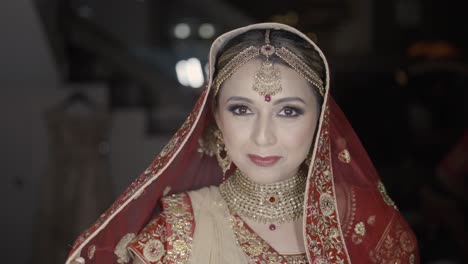 indian woman in her bridal red veil during her wedding day