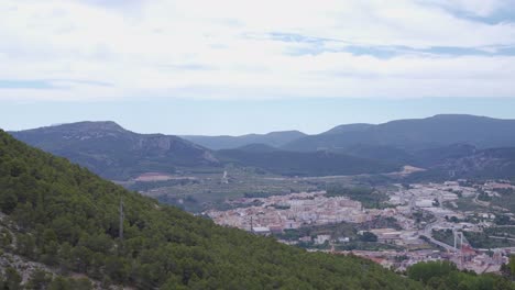 city in a mountain valley,mountainside with trees,alcoi,valencia,spain