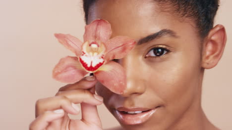 woman, face and flower with smile for skincare