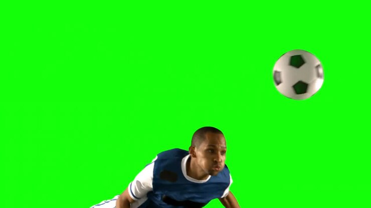 Football player heading the ball