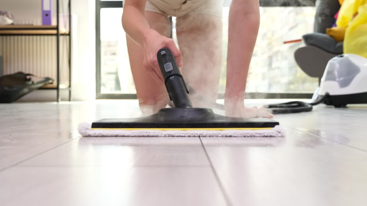 Woman Cleaning Hard Floor with Steam Mop for Hygiene