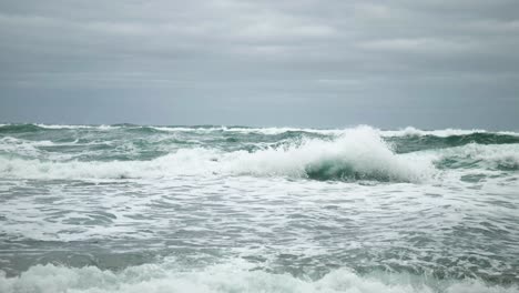 Captivating-footage-of-violent-waves-crashing-onto-the-shore,-showcasing-the-raw-power-of-nature