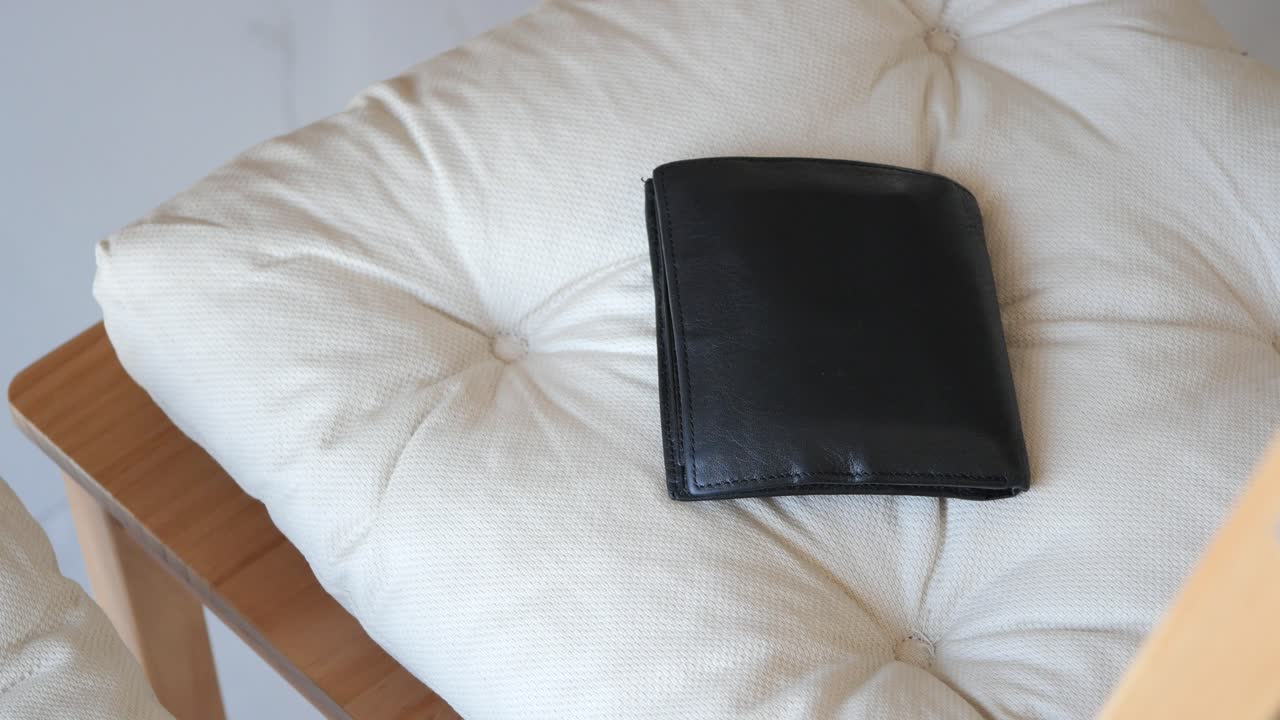Black Leather Wallet on a Chair