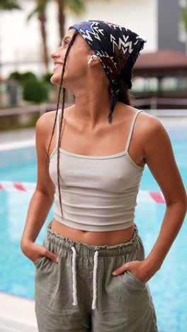 young woman relaxing by the pool