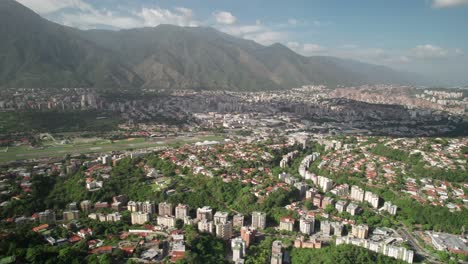 panning drone of el cafetal neighborhood in caracas showing dense rooftops