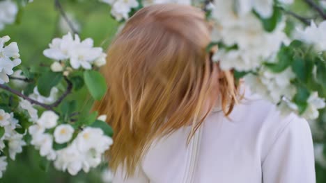 girl in a blooming apple tree