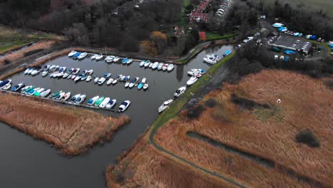 aerial - marina on river waveney, somerleyton, england, wide spinning shot