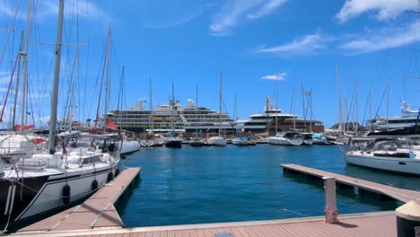 luxury yachts and cruise ships docked at a marina
