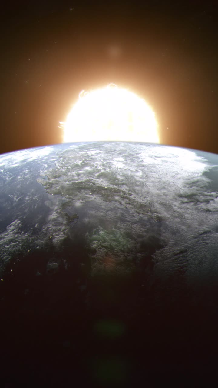 Vertical Shot of Planet Earth Seen From Space as the Close and Large Sun Rises Up From Behind