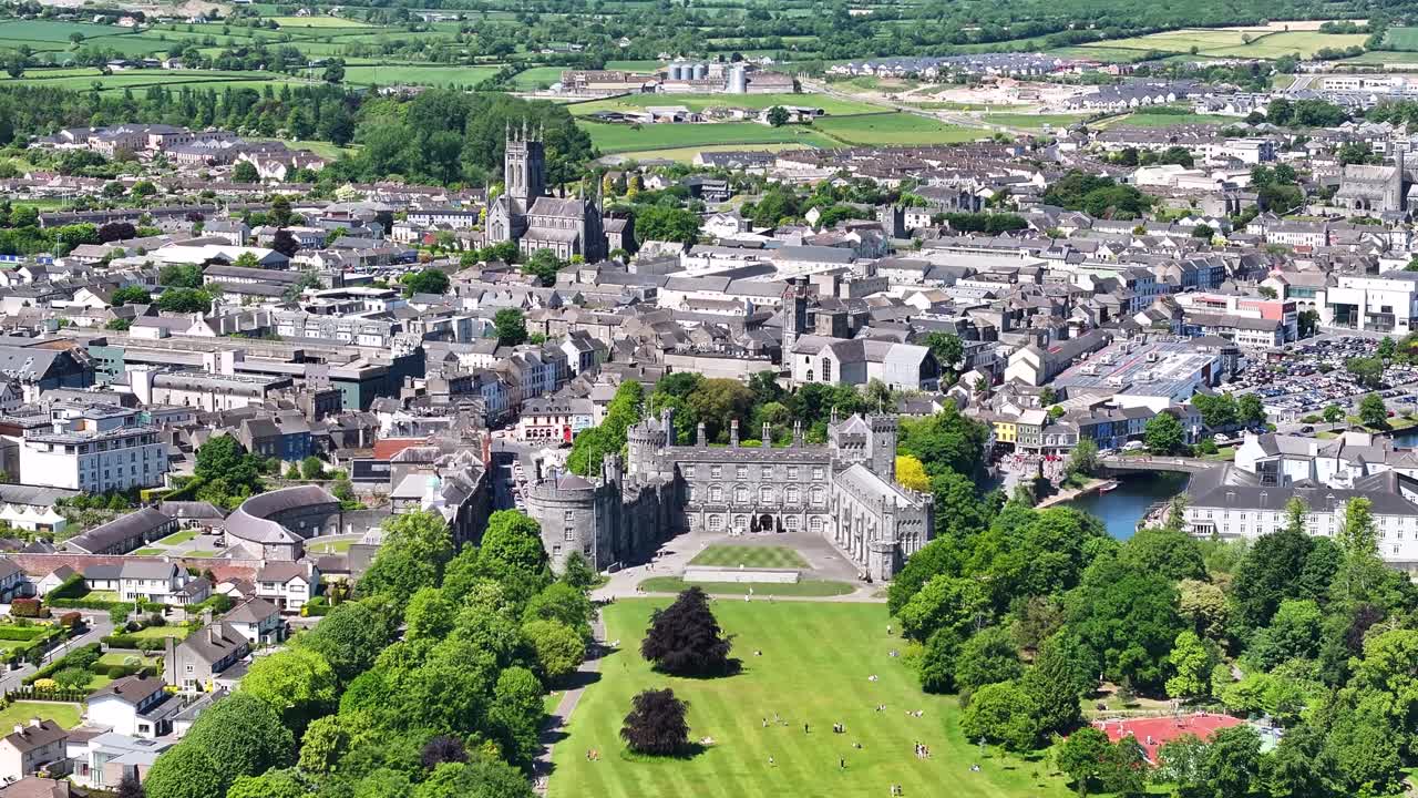 Kilkenny Castle and city panorama, tourist attraction, historical landmark. Ireland. Drone sunny