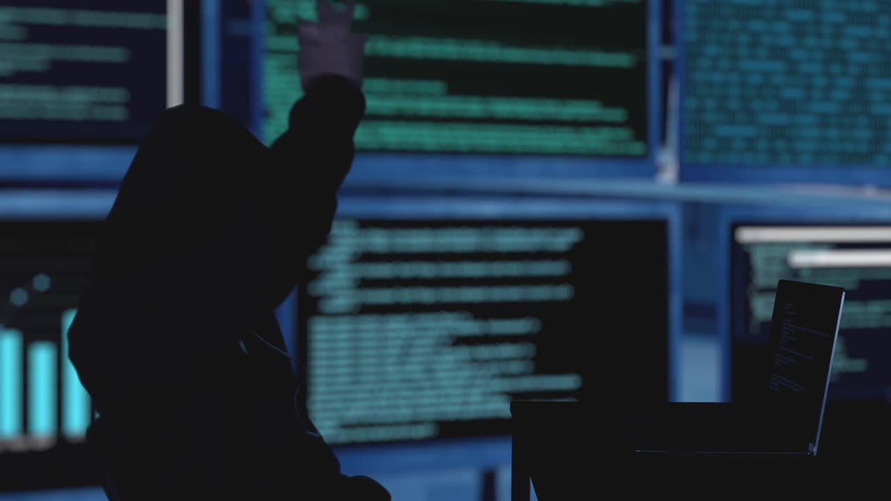 Masked hacker succeeding to steal security server