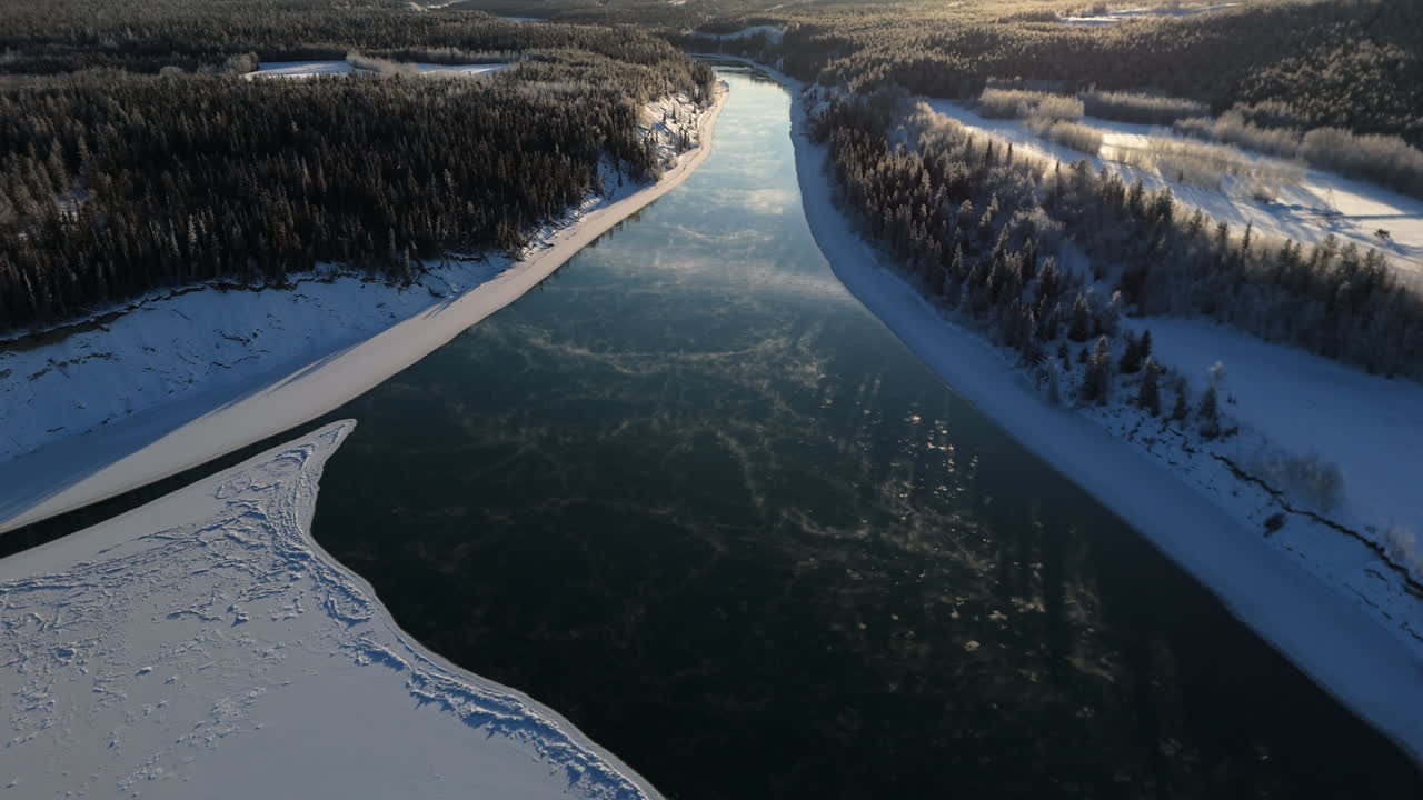 Yukon River And Frozen Lake Laberge During Winter In Canada - Drone Shot