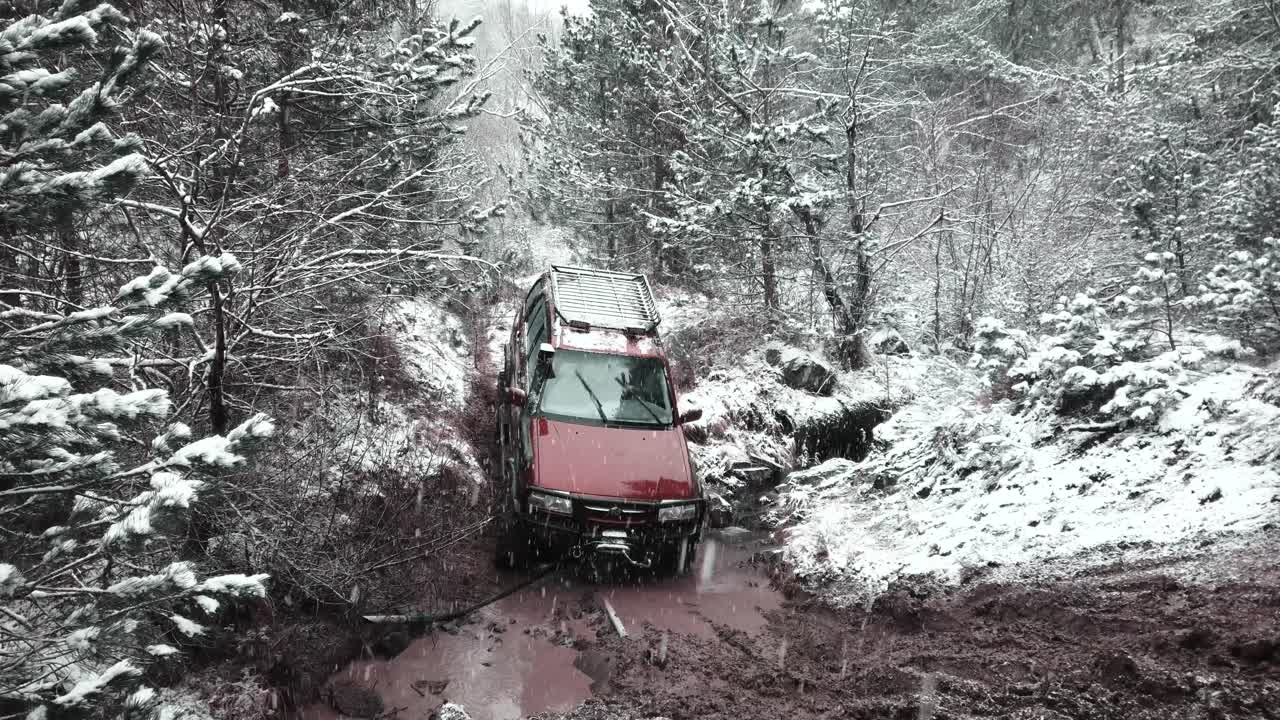 Red SUV Stuck in Snowy Mud