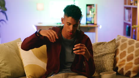 young man angry at a video game on a phone