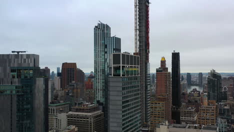 aerial view of new york city's skyscrapers on an overcast day