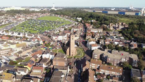 aerial 4k drone footage, panning the horizon of the small coastal town of wijk aan zee in north holland, the netherlands