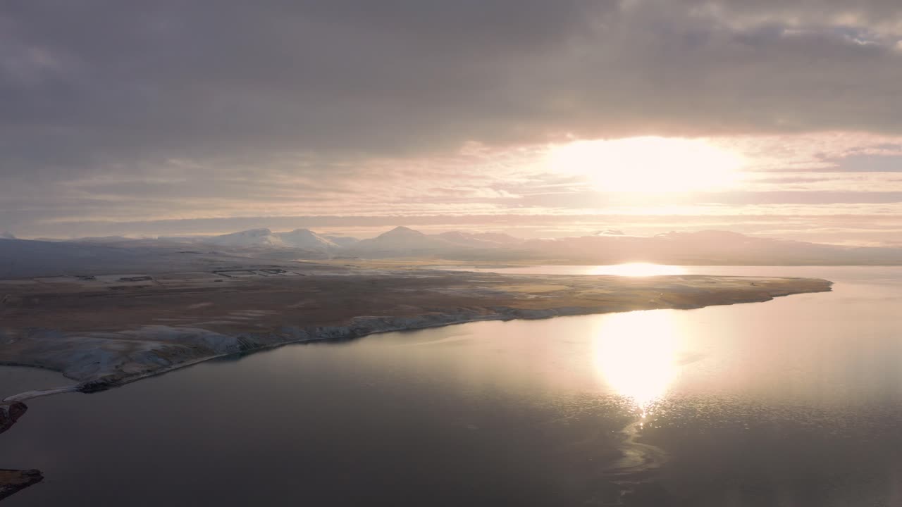 Aerial View of Sunset Above Westfjords, Iceland. Sunlight and Sky Reflection on Sea Water at Summer, Panoramic Drone Shot