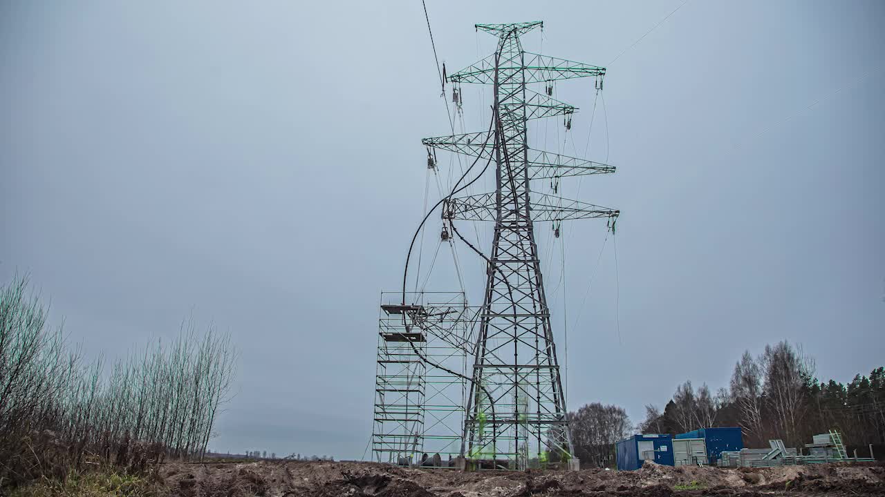 Erecting a scaffold to repair an electrical transmission tower - winter time lapse