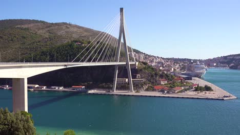 a large suspension bridge over a harbor near dubrovnik croatia