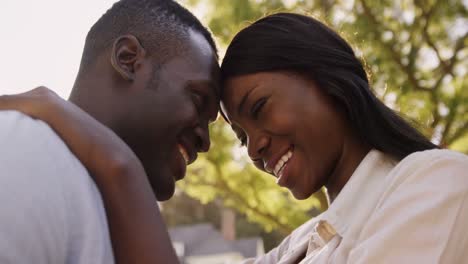 Low-angle-view-of-couple-embracing-and-talking