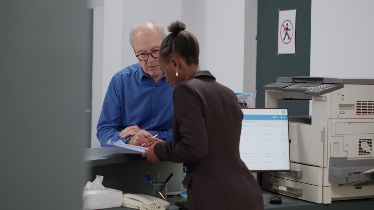Patient checking in at hospital reception