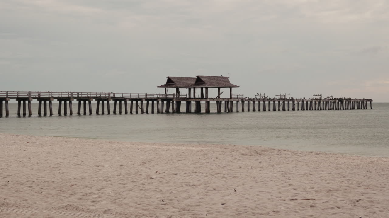 Abandoned Pier at Beach at Sunrise/Sunset