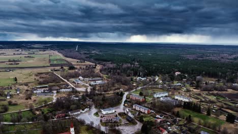 gloomy storm clouds sweep across rural landscape of rucava in moody timelapse