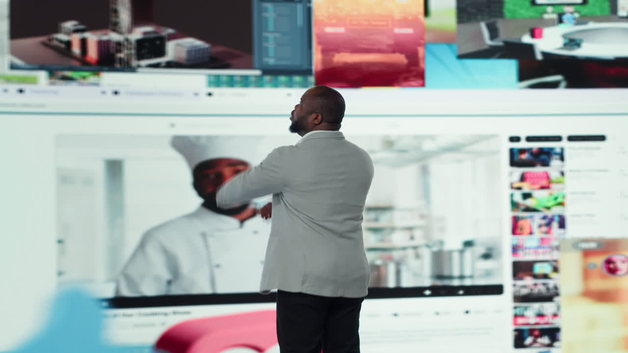 Vertical video Man surrounded by streaming videos on digital videowall