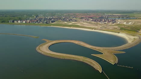 aerial drone shot over the peninsula tulip island  on the coastline of the zeewolde, the netherlands.
