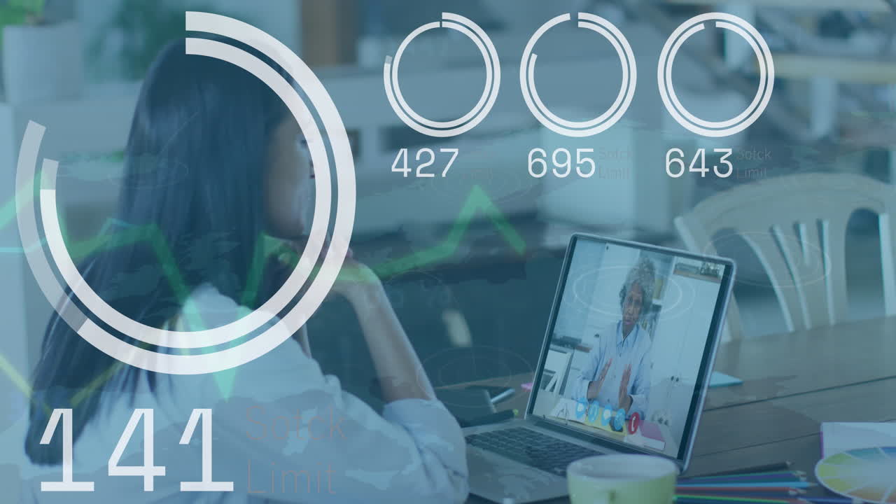 Animation of data processing against biracial woman having a videocall on laptop at office