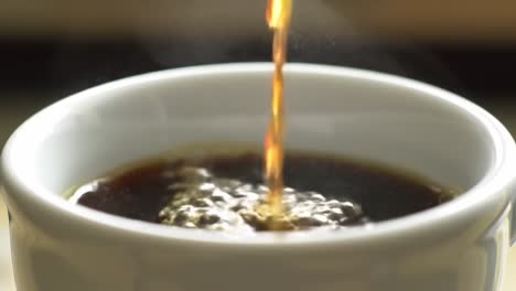 a close-up scene of coffee pouring into a white cup, capturing the rich aroma and steam rising in the air, highlighting the comfort and ritual of morning beverages