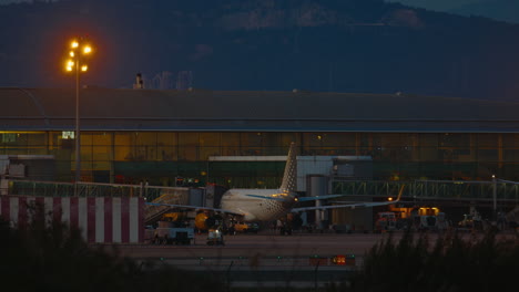 airplane at airport at dusk