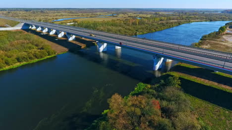 Road-bridge-river.-Drone-view-of-highway-road-and-car-bridge-over-water