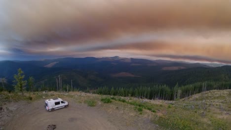 camper van off road at summit during smoky sunset, frame rate 59