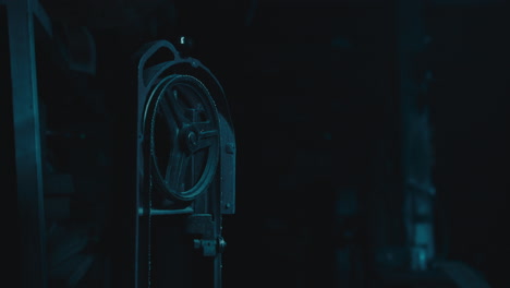 mysterious man in the workshop at night smokes a cigarette
