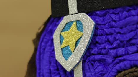 Chase-inspired-Paw-Patrol-pinata,-close-up-on-foam-diamond-police-badge