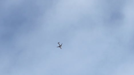 tracking follows airline plane jet take off against open empty sky, porto