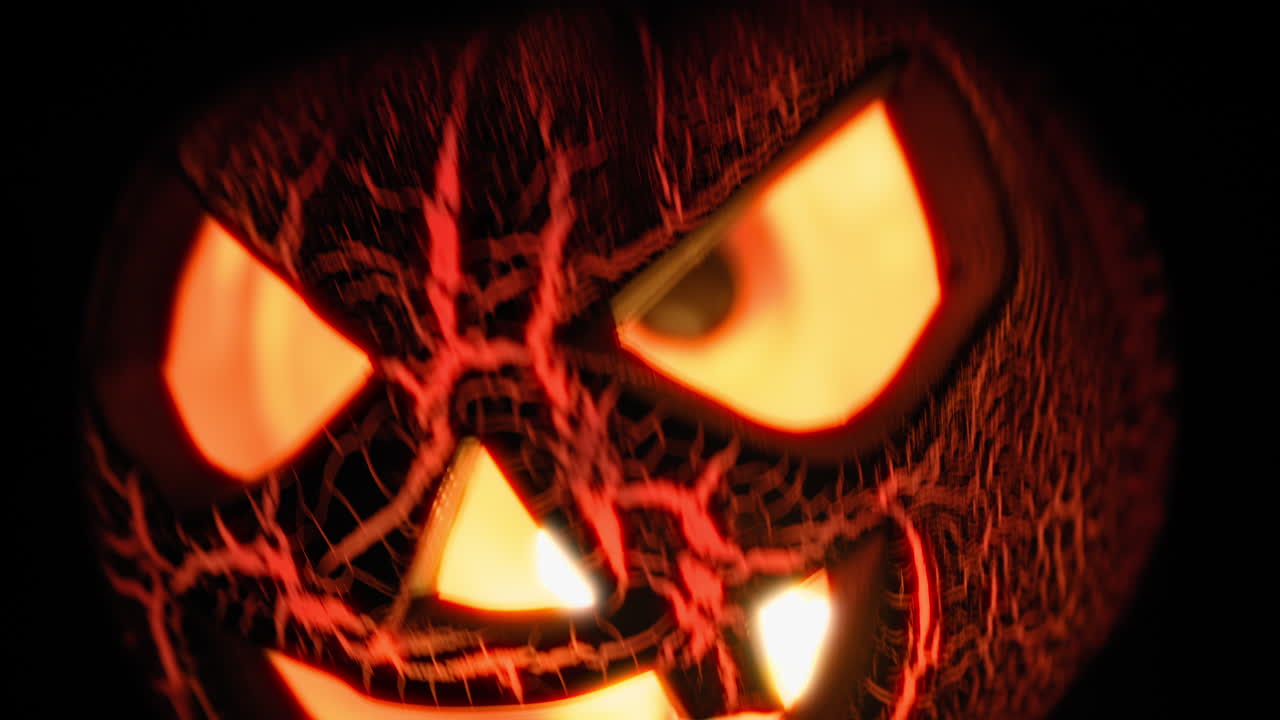 Glowing Halloween Pumpkin Waving on Black Background