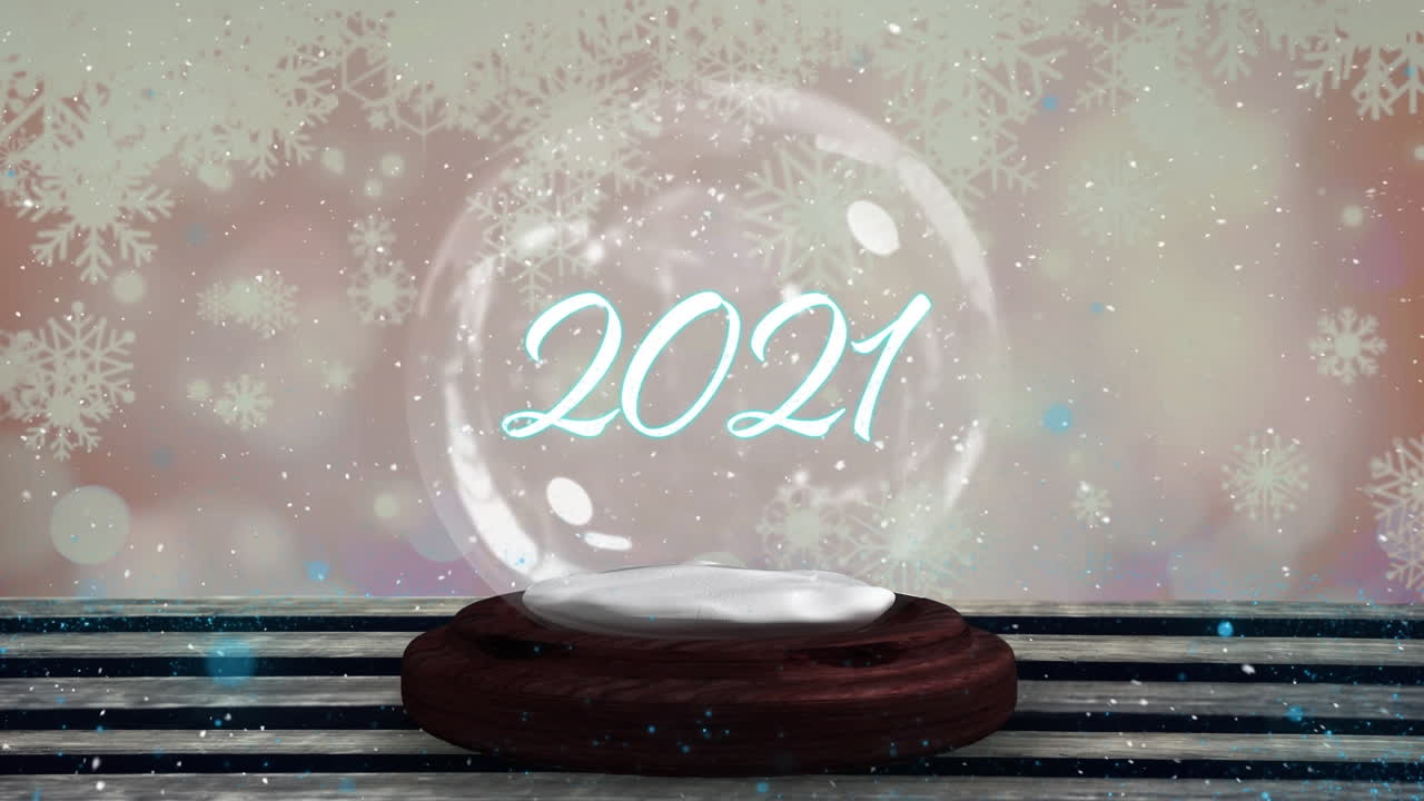 estrella fugaz azul alrededor de 2021 texto sobre un globo de nieve en una tabla de madera