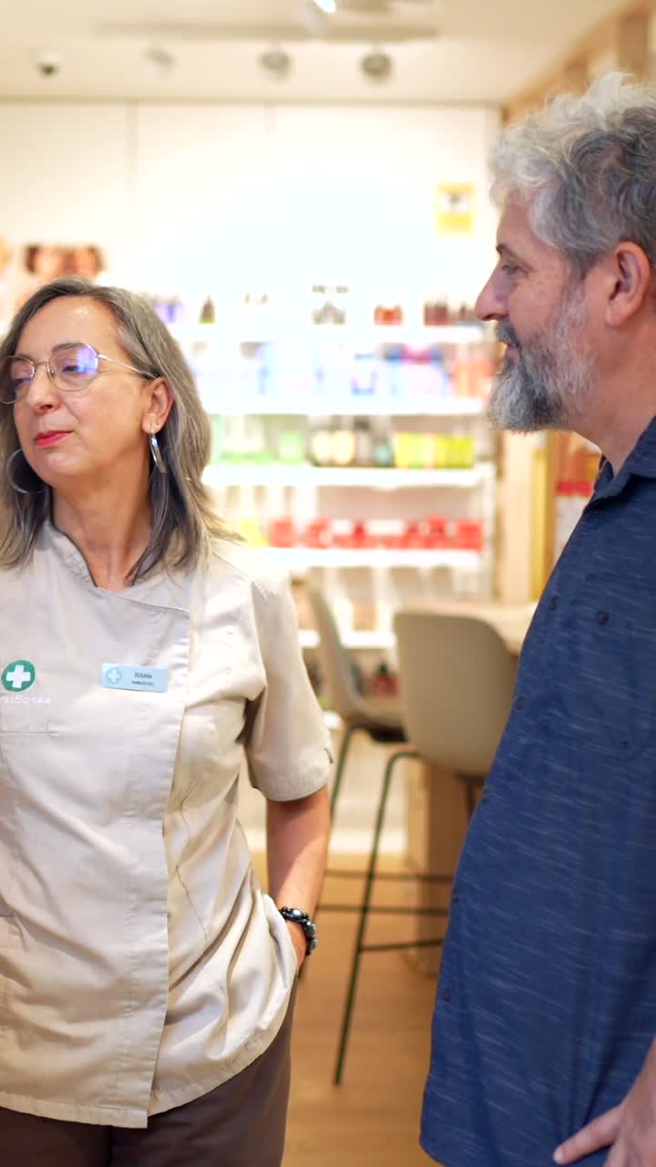 Pharmacist assisting a customer in a pharmacy