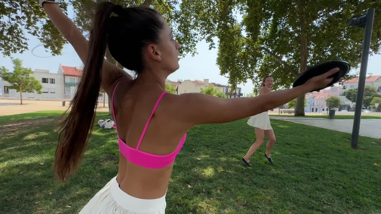People playing sports in a park