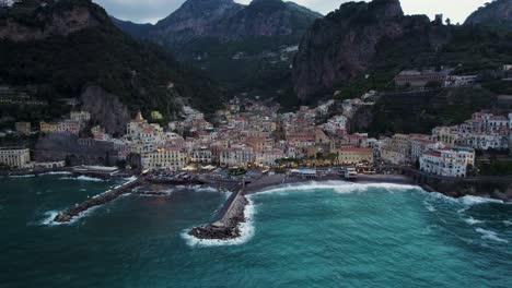 Evening-Lights-of-Famous-Touristic-Town-of-Amalfi-on-Italy-Coast,-Aerial