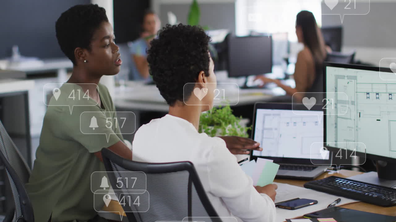 Animation of multiple notification bars over diverse female coworkers discussing reports on computer