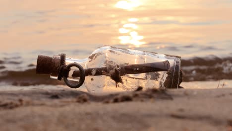 message in the bottle against the sun setting down