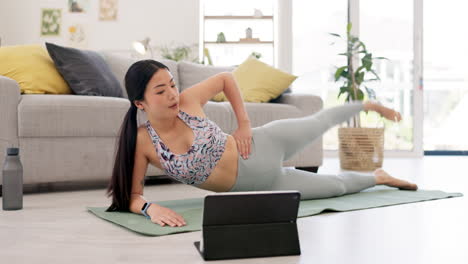 Fitness,-home-pilates-and-woman-on-tablet