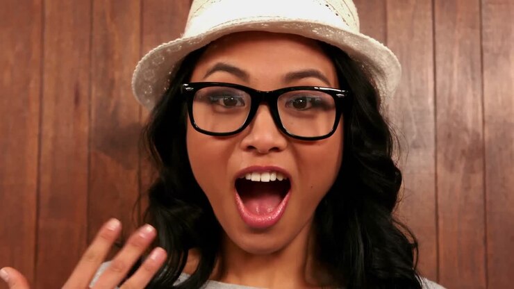 Surprised hipster looking at camera