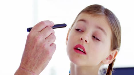 male doctor examining a patient