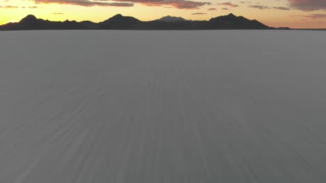 fast-moving aerial shot of a sunset on the bonneville salt flats in western utah